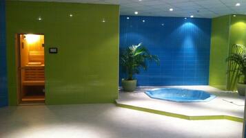 Relax by the pool surrounded by lush greenery and natural light.
