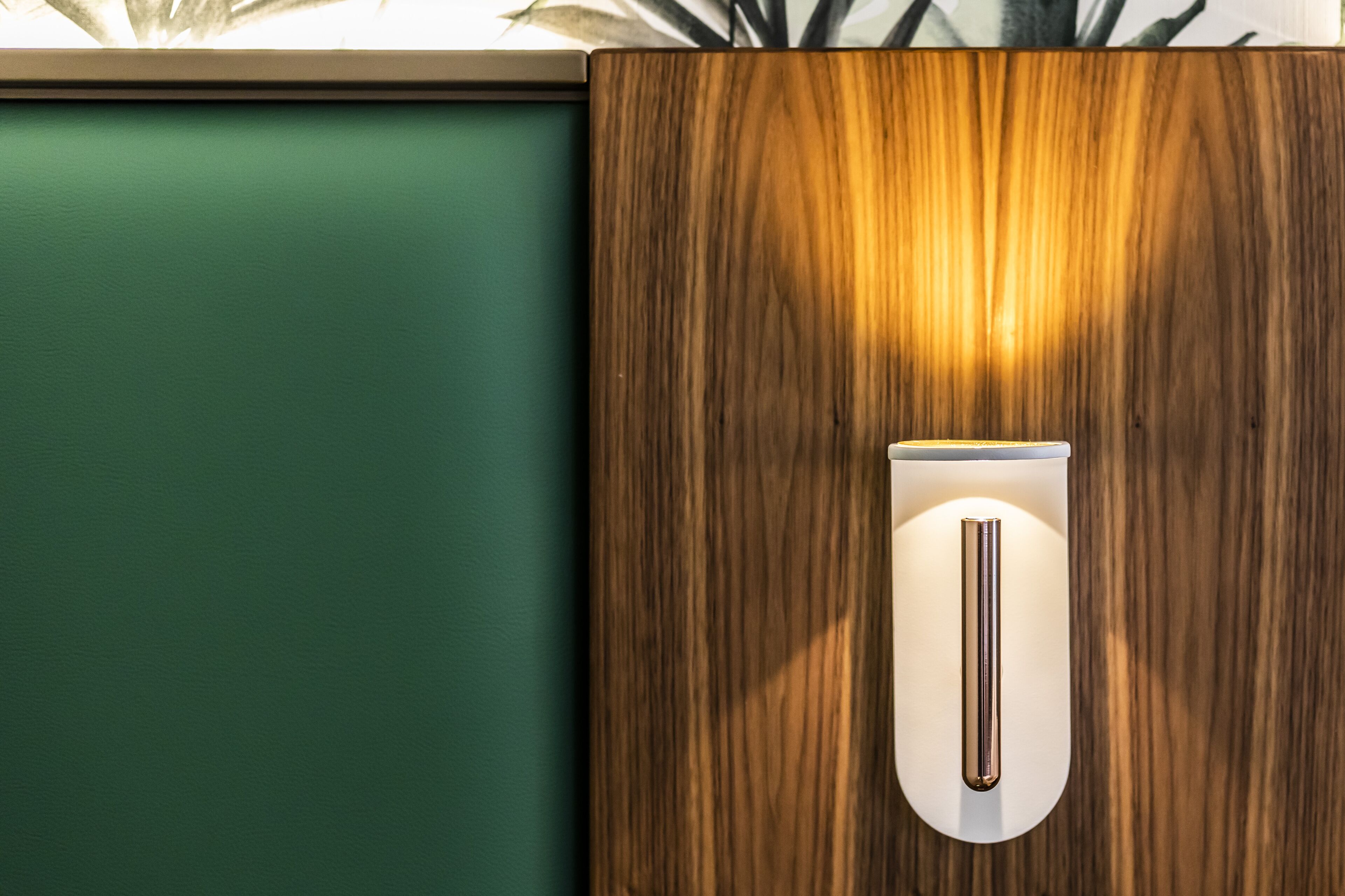 A wooden cabinet with a light fixture on top.