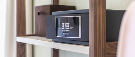A security keypad on a shelf with a wooden frame.