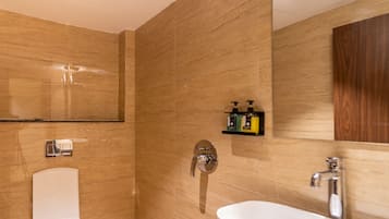 Shower, designer toiletries, hair dryer, slippers