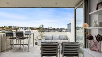 A modern outdoor seating area with a view of the cityscape.