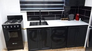 Fridge, cookware/dishes/utensils, dining tables