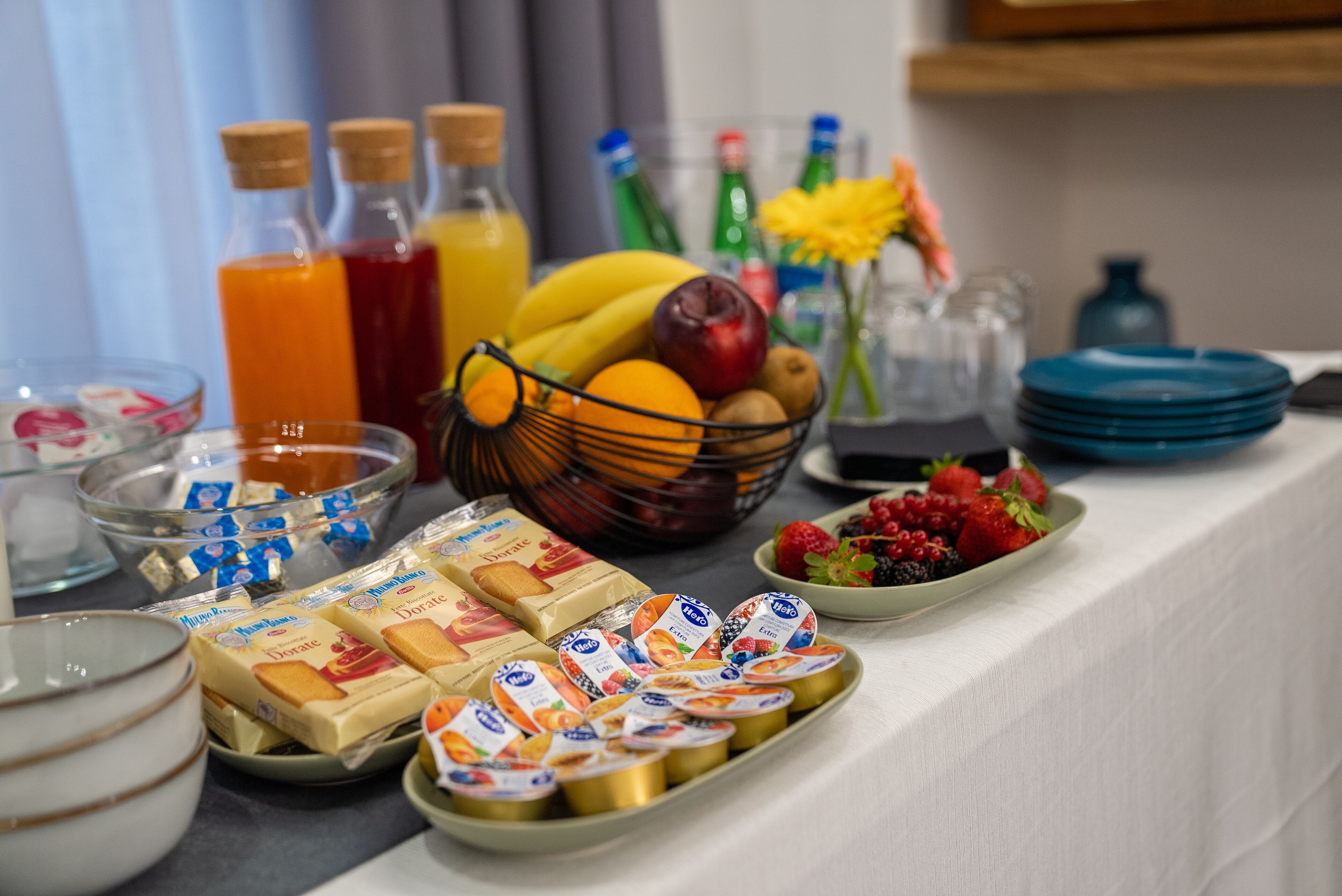 A breakfast buffet with various food items and beverages.