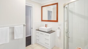 Bathtub, eco-friendly toiletries, hair dryer, towels