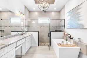 Bathtub, hair dryer, towels, soap
