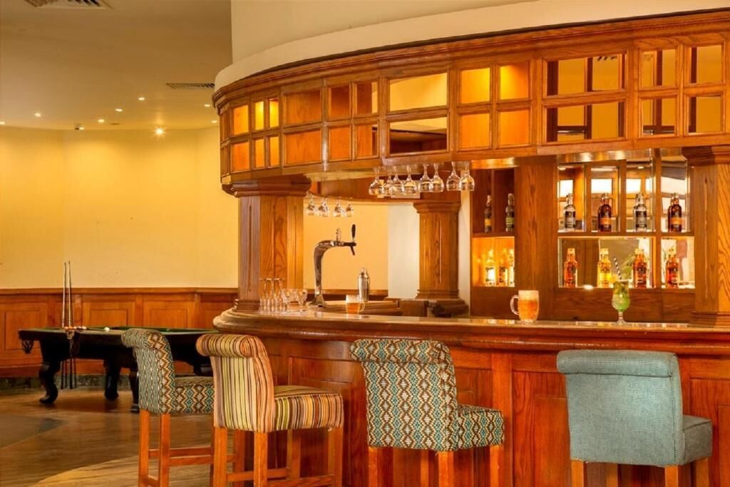 7 bars/lounges, poolside bar, beach bar