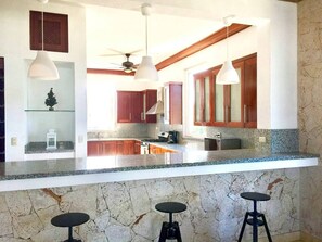 Fridge, cookware/dishes/utensils, dining tables