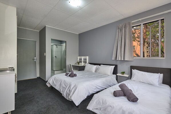Family Room | Desk, laptop workspace, blackout drapes, soundproofing - Inn & Out Sandton (Sandton)