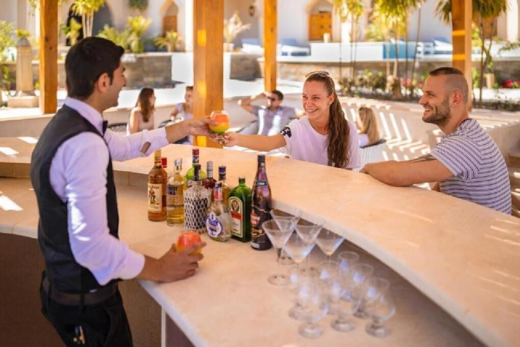 6 bars/lounges, poolside bar, beach bar