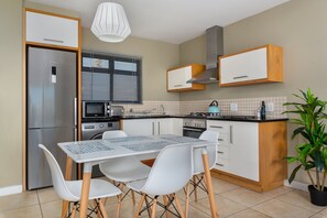 Classic Apartment | Private kitchen | Full-size fridge, microwave, oven, stovetop - Knightsbridge 108 (Cape Town)