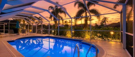 A heated pool, sun loungers