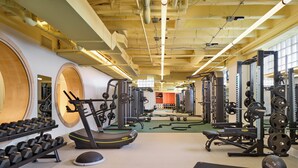 A gym with treadmills, weight machines, and free weights. - 21C Museum Hotel St Louis  (St. Louis)