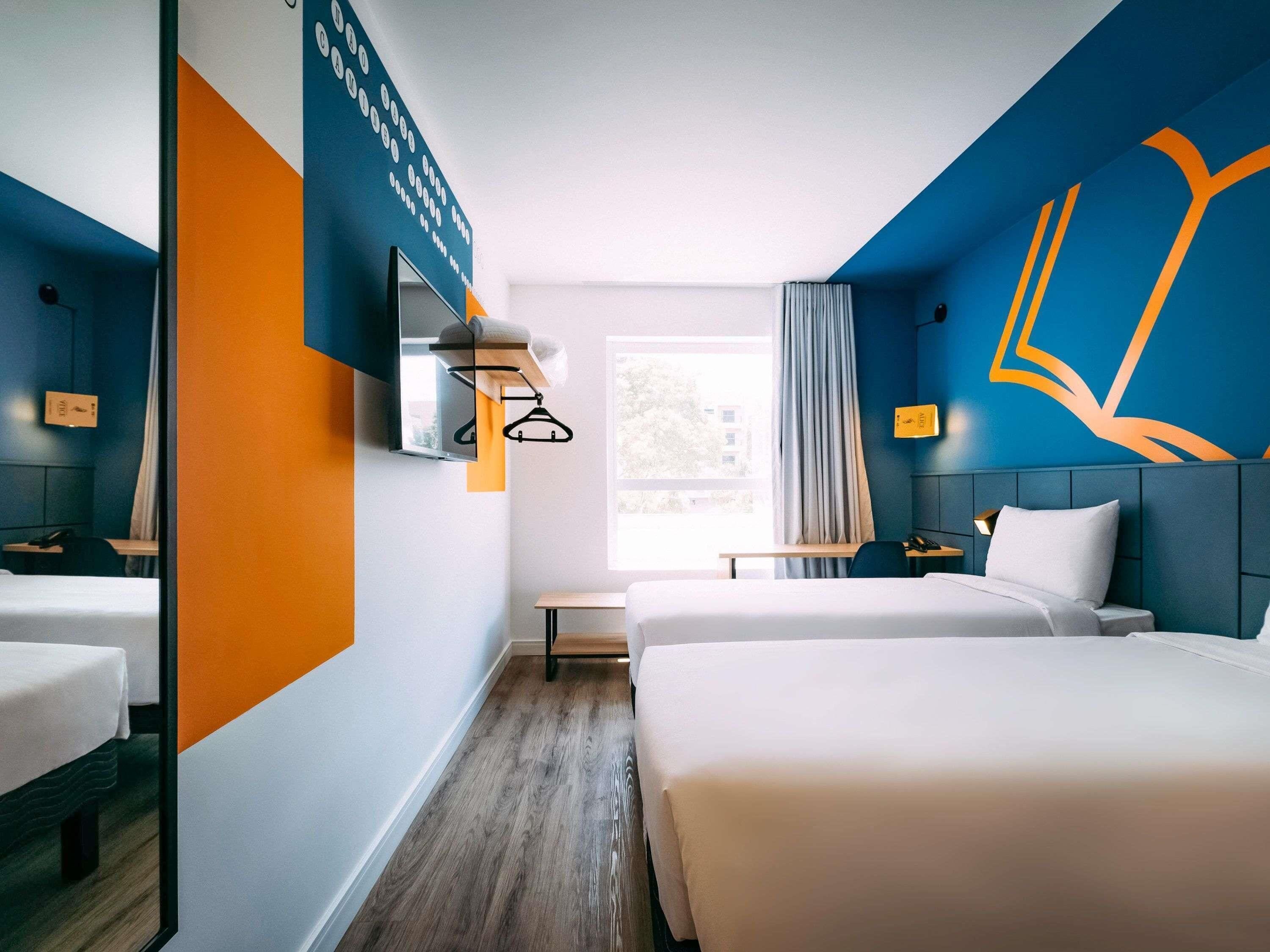 Apartamento standard, 2 camas de solteiro | Individualmente mobiliados, escrivaninha