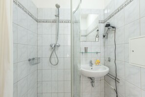 Shower, towels, toilet paper