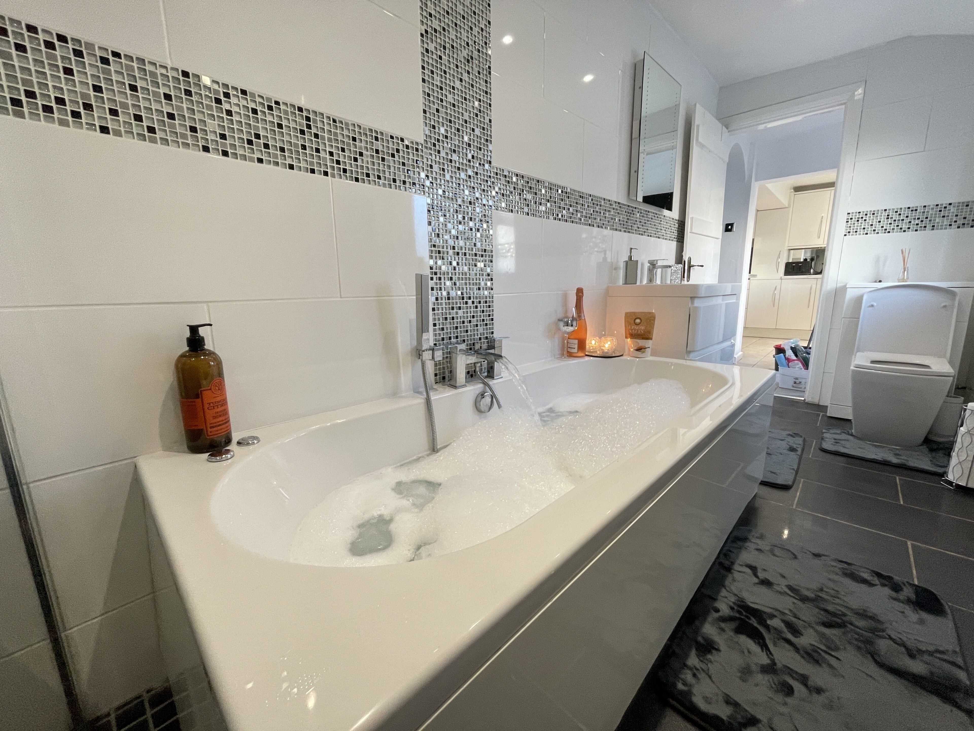 Combined shower/bathtub, hair dryer, towels, soap