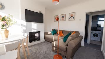 Luxury Apartment, 2 Bedrooms, Park View, Garden Area | Living area | 32-inch Smart TV with cable channels, TV