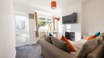 Luxury Apartment, 2 Bedrooms, Park View, Garden Area | Living area | 32-inch Smart TV with cable channels, TV