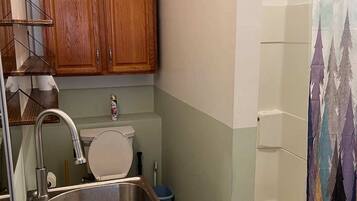 Bathtub, hair dryer, towels