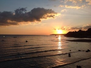 On the beach, sun loungers, beach towels