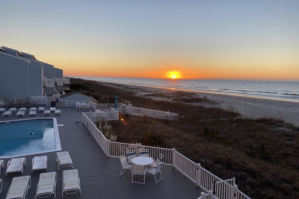 Pool and beach at sunset