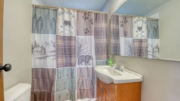 Combined shower/tub, hair dryer, towels, soap