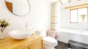 Combined shower/bathtub, hair dryer, towels, soap