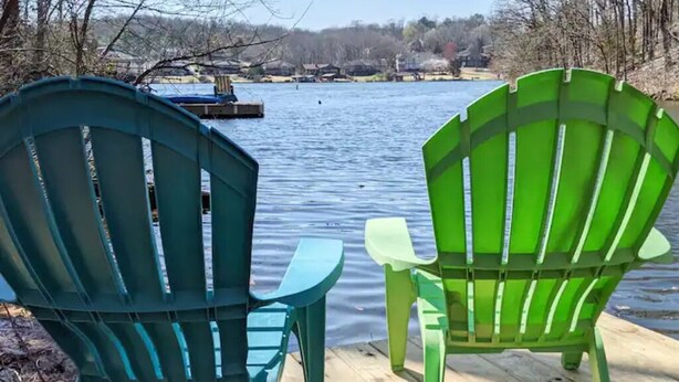 Two Adirondack chairs on a wooden dock by a lake. - Lakefront Getaway |Private Dock + Free Kayaks (Bella Vista)