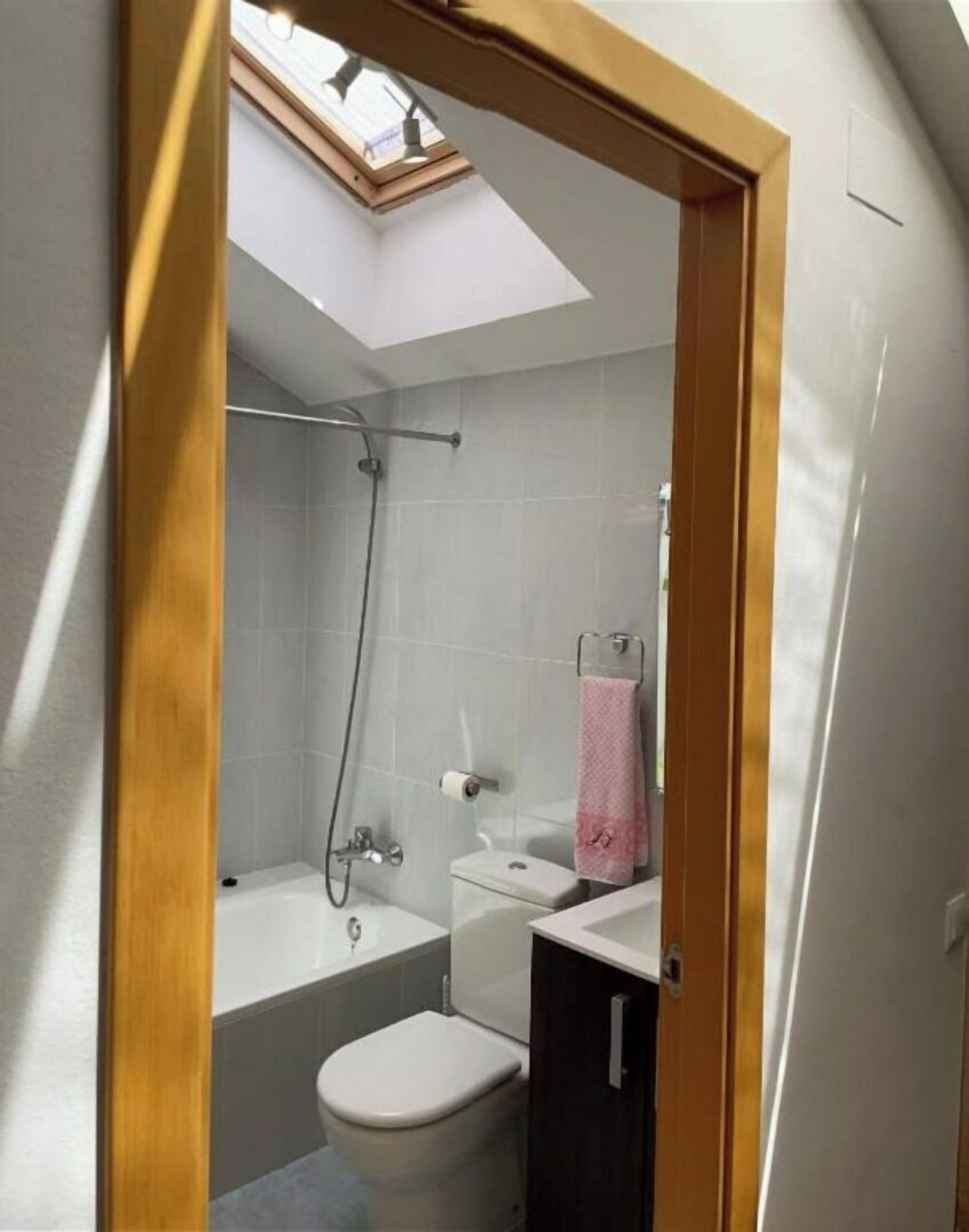 Shower, hair dryer, towels, toilet paper