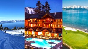 Een houten lodge met een zwembad, omgeven door sneeuw en bergen.