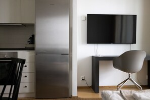 Apartamento empresarial | Área de estar | TV 36 polegadas com canais a cabo