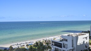 A beachside hotel with a pool, beach umbrellas, and a view of the ocean. - Stunning ocean front unit 2/2 with privet beach excess (Hollywood)
