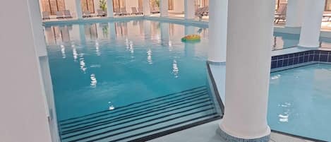 Indoor pool, open 10:00 AM to 9:00 PM, pool loungers