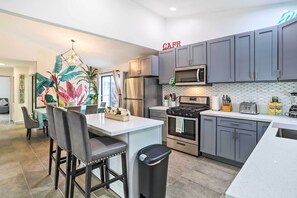 Fridge, microwave, stovetop, coffee/tea maker