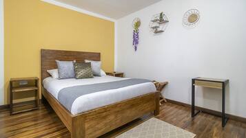 Premium bedding, down comforters, blackout drapes, iron/ironing board