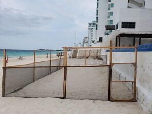 On the beach, sun loungers, beach towels