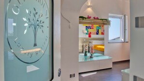 A modern hotel interior with a glass door featuring a tree logo and the words "Luxury Retreat." - Olive House, luxury retreat (furore)