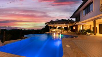 Outdoor pool, open 6:00 AM to 10:00 PM, pool umbrellas