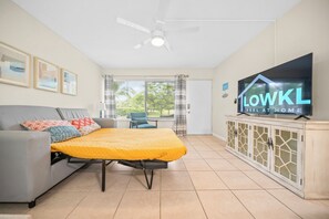 Premium Ground Floor 1-Bedroom King w/ Kitchen & Sofa Bed | Living area | 42-inch Smart TV with satellite channels, TV, Netflix - Riverwatch Apartments by Lowkl (Jensen Beach)