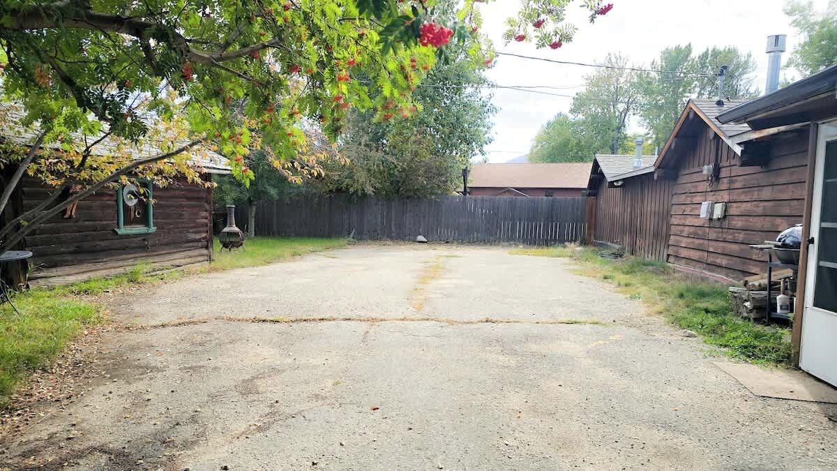 The parking area/courtyard is private and fenced. There is a grass section in the back great for dogs and also has a firepit for guests.