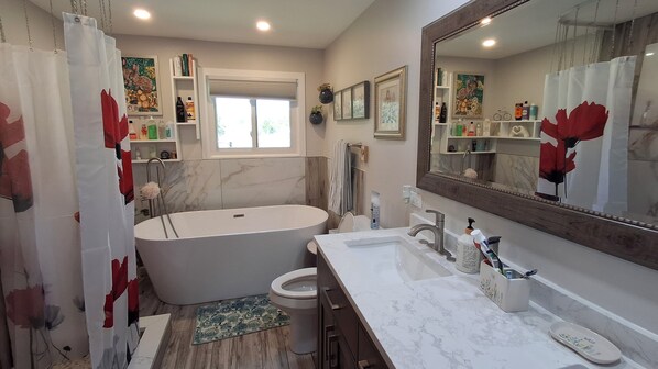 Bathtub, hair dryer, towels, soap