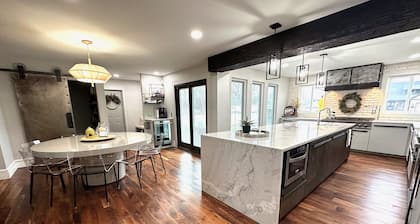 High-end home w/ fireplace, gourmet kitchen, sauna, game rm/ large yard/fire pit