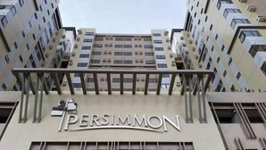 A building with a sign that reads "PERSIMMON". - Stunning Studio Type - 1641 - 16th Flr Persimmon (Cebu)