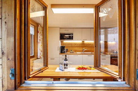 Fridge, microwave, oven, stovetop. Vacation Home "Dünser" with Mountain View, on a sunny slope.