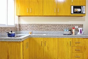 Fridge, stovetop, cookware/dishes/utensils, dining tables