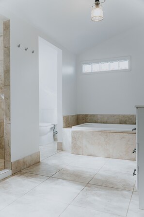 Bathtub, hair dryer, towels, soap
