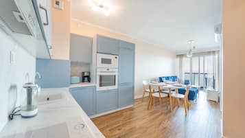 Apartment (70 with sea view) | Living area | Flat-screen TV