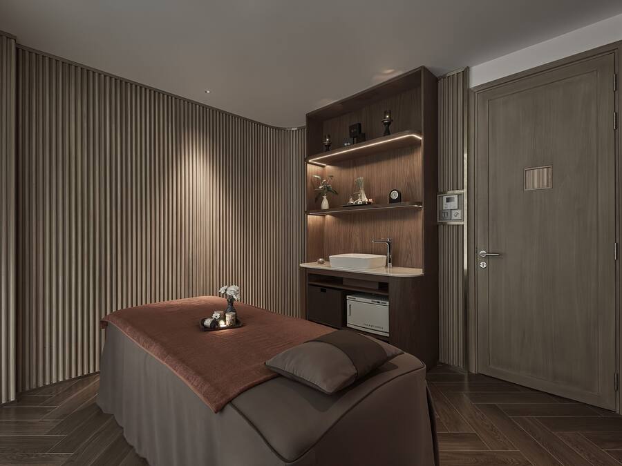 A modern bathroom with a large mirror, a sink, and a vanity.