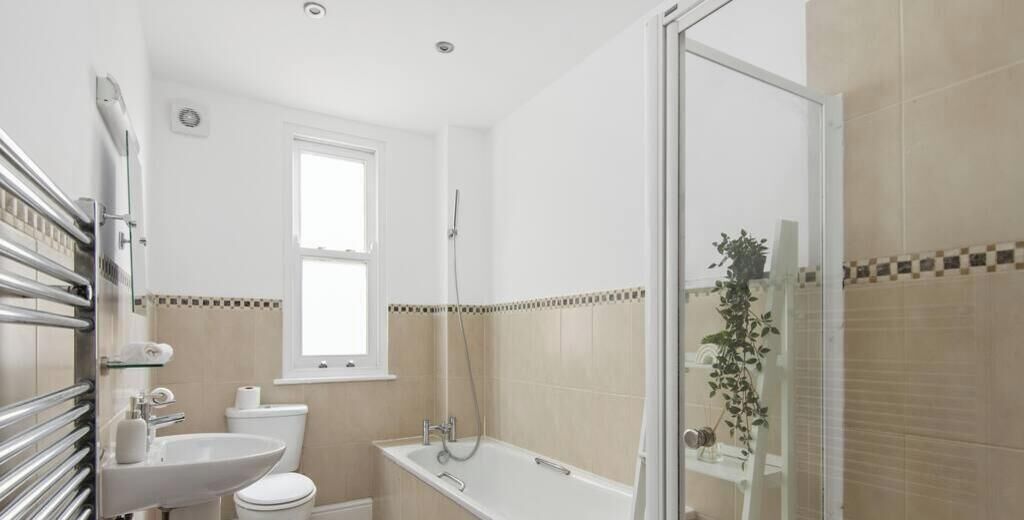 Bathtub, hair dryer, shampoo