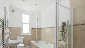 Bathtub, hair dryer, shampoo