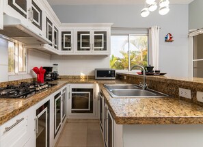 Fridge, cookware/dishes/utensils, dining tables